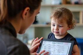 Educator conducting development assessment with child